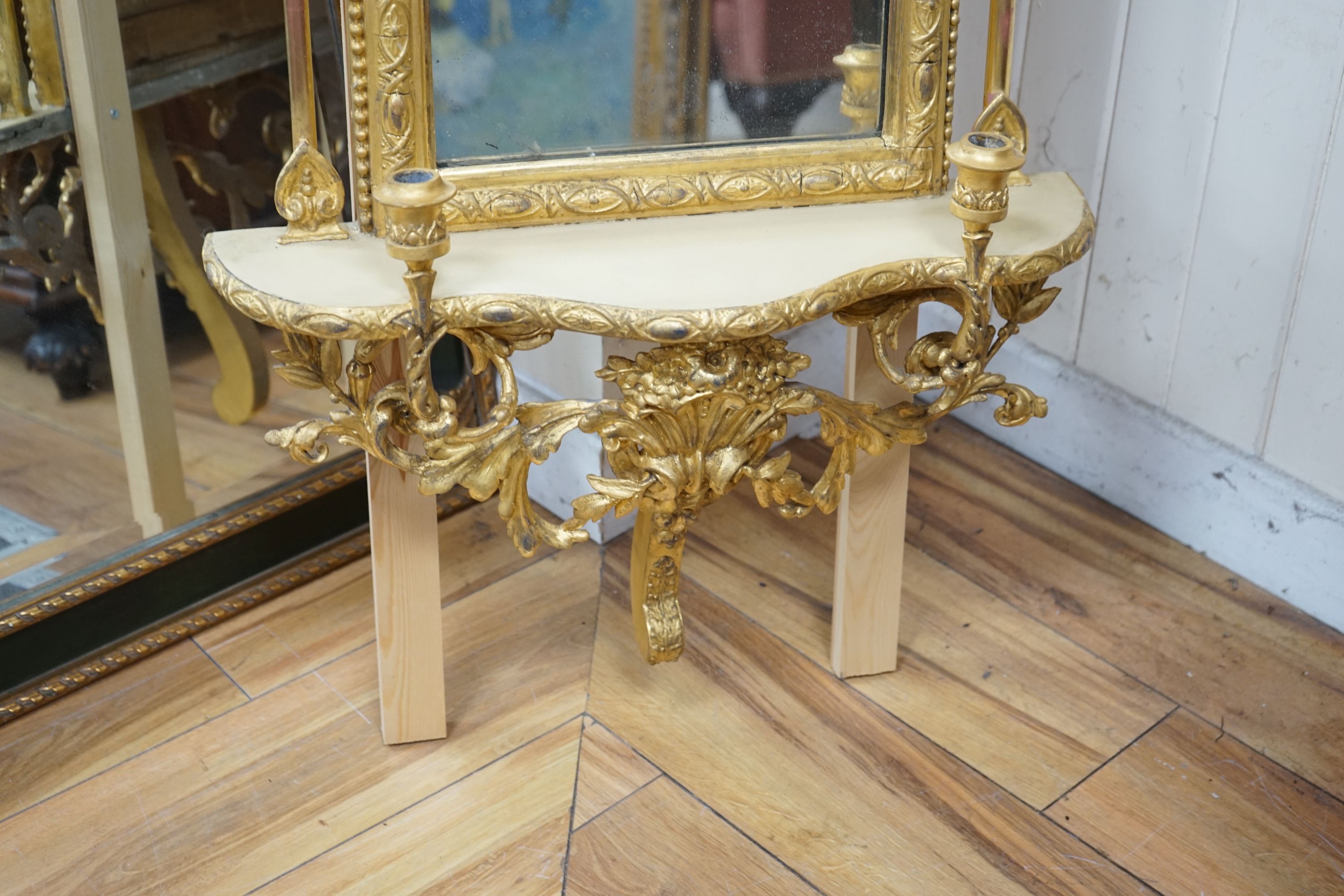 A 19th century giltwood and gesso girandole pier glass, width 54cm height approx. 155cm